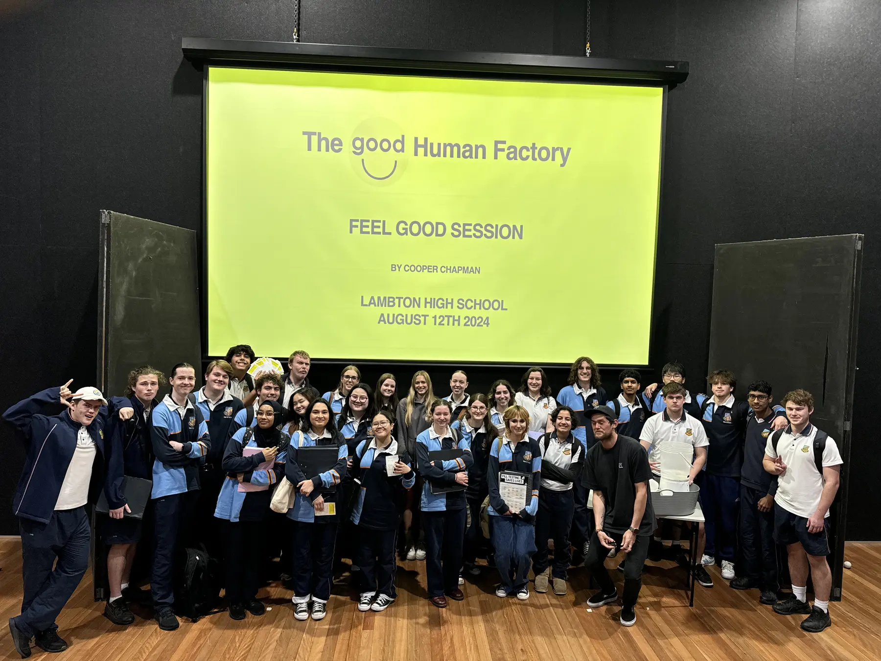 Cooper Chapman with high school students after a Good Human Factory workshop